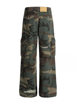 Men's distressed camouflage cargo pants with multiple pockets and raw hem detail.