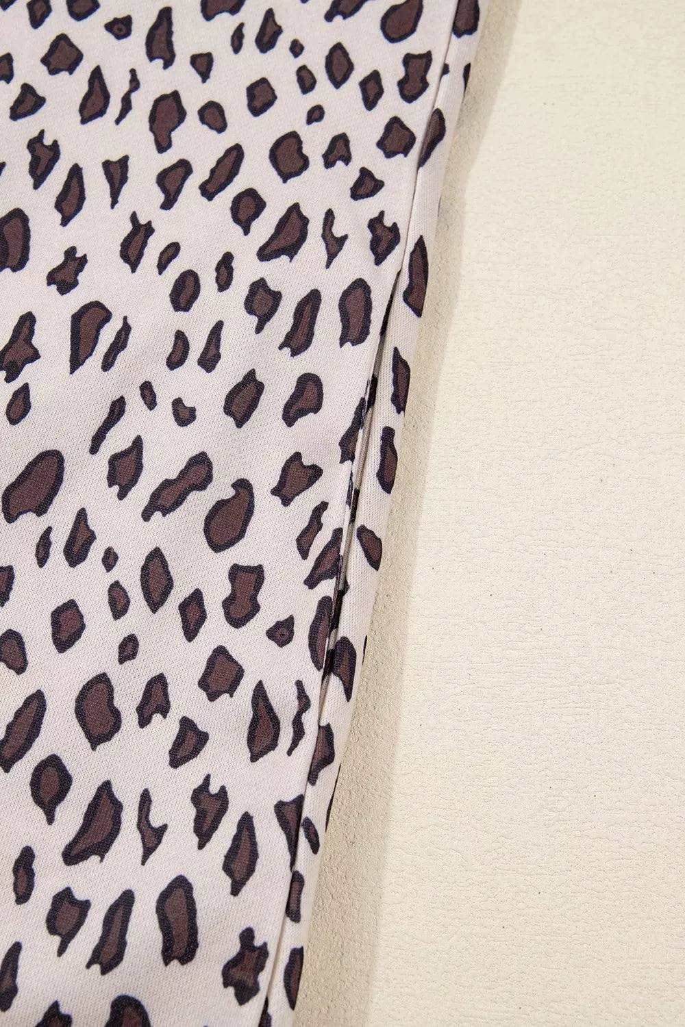 Leopard print mini dress with zip-up collar detail in cotton fabric.