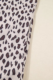 Leopard print mini dress with zip-up collar detail in cotton fabric.