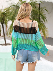Rainbow mesh cover-up with flared sleeves in cream, black, green, and turquoise stripes.