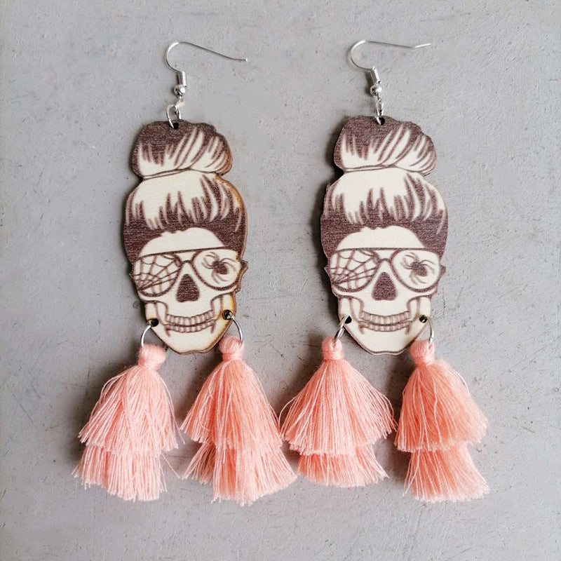 Skull bun drop earrings with pink tassels and spiderweb glasses detail