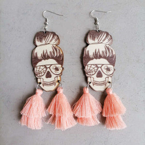 Skull bun drop earrings with pink tassels and spiderweb glasses detail