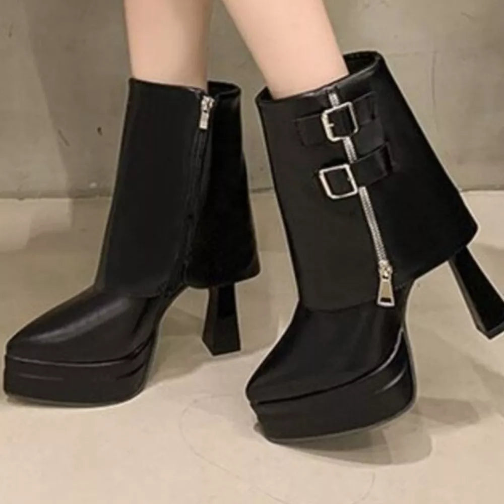 Black pointed toe block heel ankle boots with platform sole, buckle straps, and side zipper.