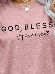Dusty Pink God Bless America script graphic tee with crewneck.