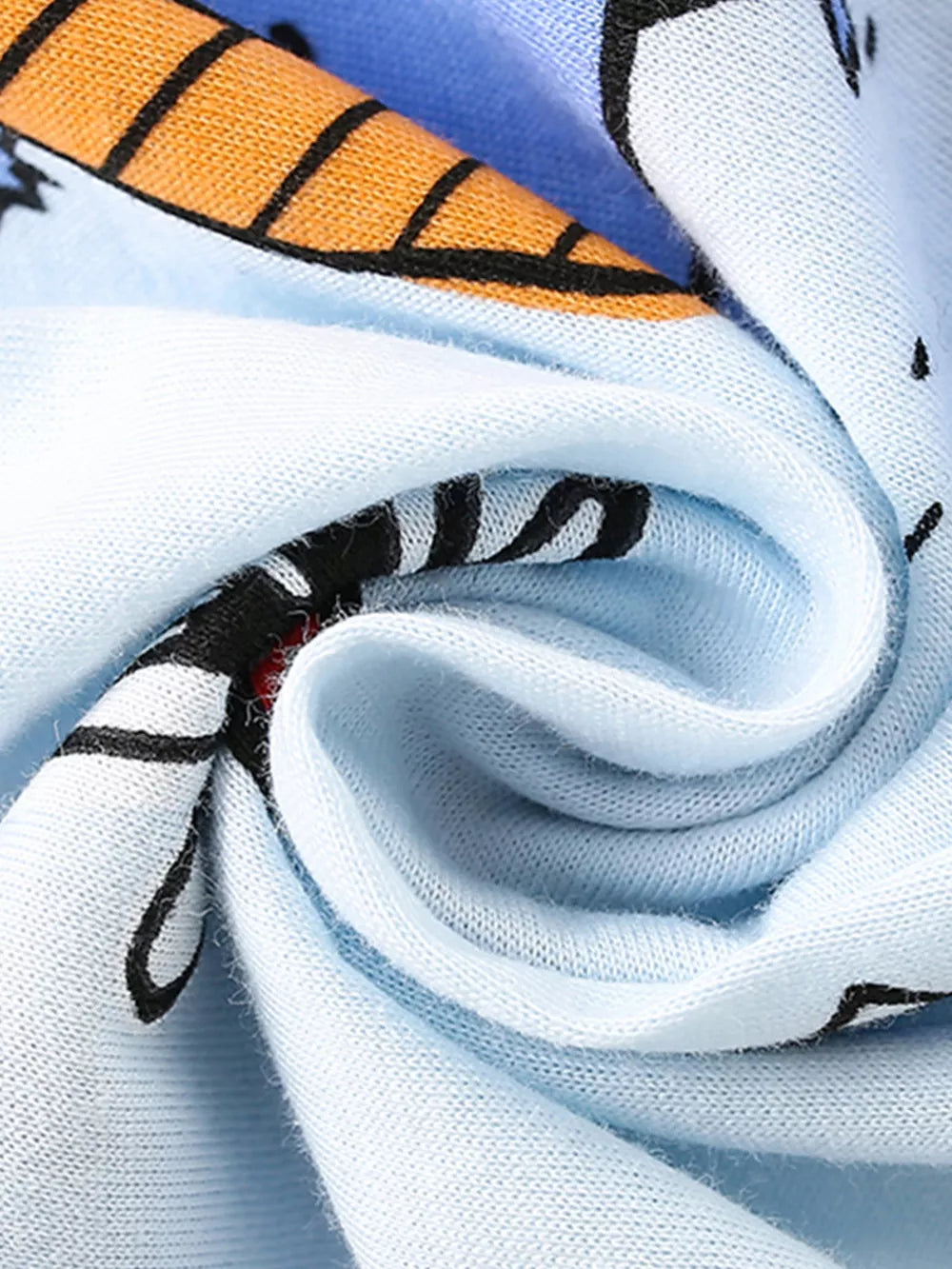 Light blue cotton t-shirt with playful dinosaur print detail