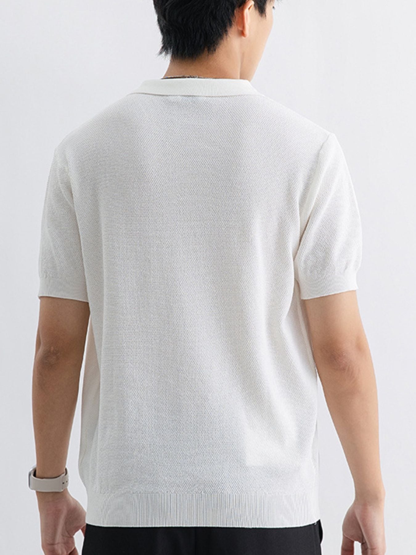 White textured knit zip-up polo shirt for men with short sleeves.