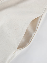 Button front tube maxi dress in beige cotton blend with a side pocket detail.