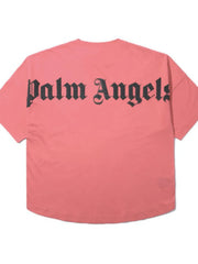 Burnt Coral oversized tee with black gothic logo print on back.