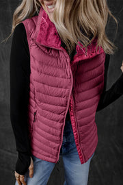 Quilted puffer vest in deep purple with a fuzzy fleece collar and zip front.