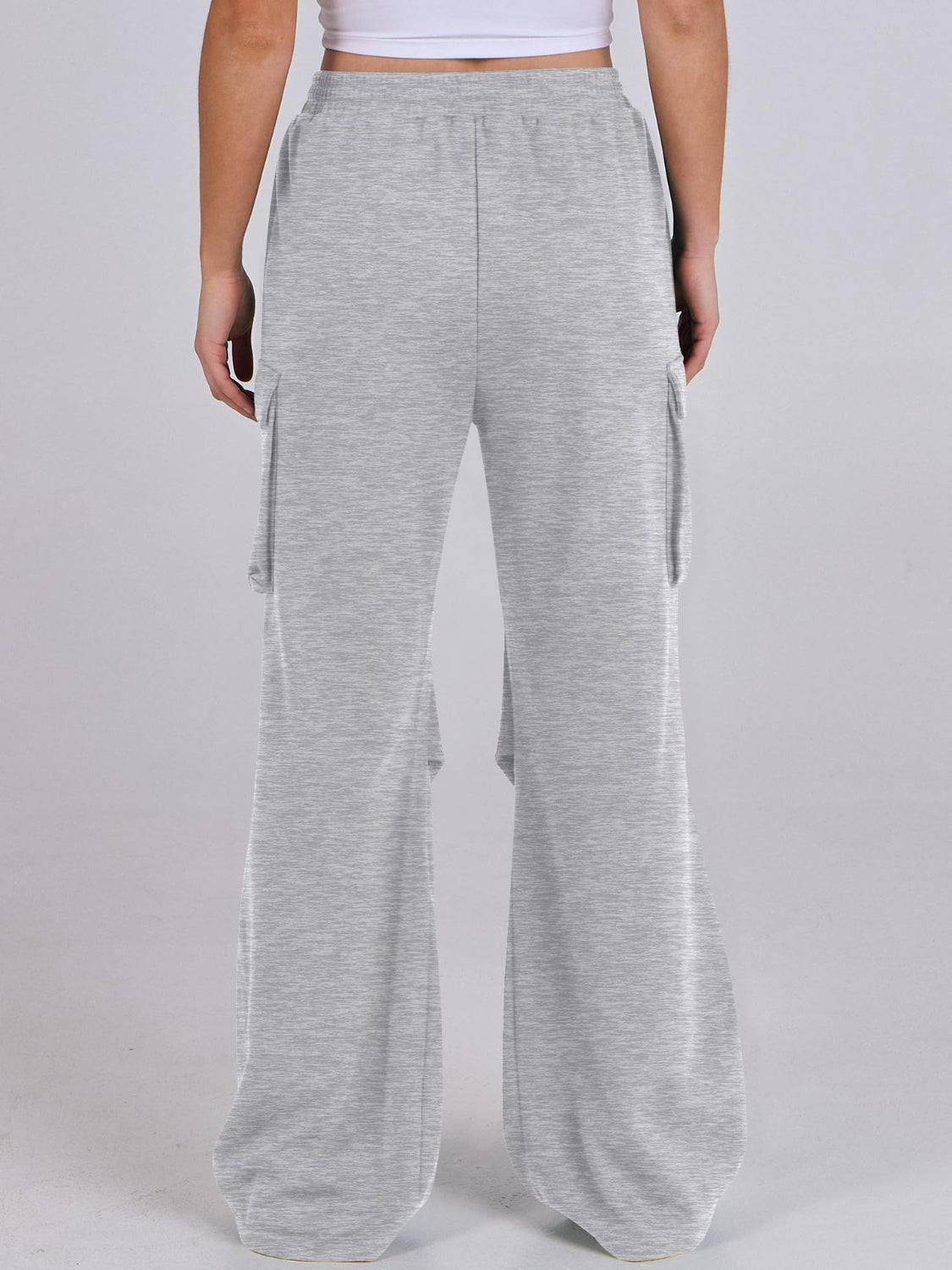 Light gray sweatpants with cargo pockets and wide legs.