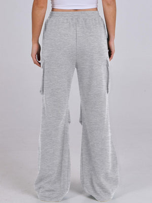 Light gray sweatpants with cargo pockets and wide legs.