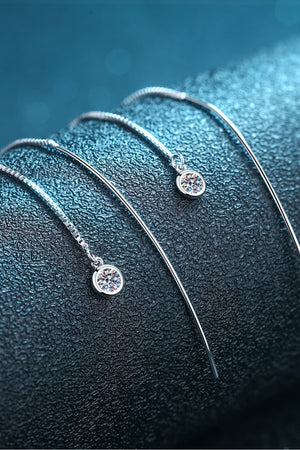 Cascading moissanite threader earrings in silver sterling silver with a single sparkling stone.