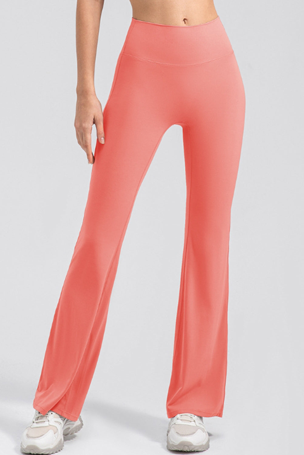 Watermelon pink flare leggings with a high waist and performance fit.