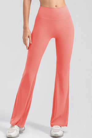 Watermelon pink flare leggings with a high waist and performance fit.