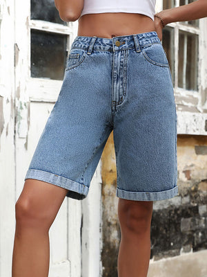 Light wash denim bermuda shorts with rolled hems and button fly.