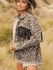 Leopard print denim jacket with black fringe embellishments and a collared neck.