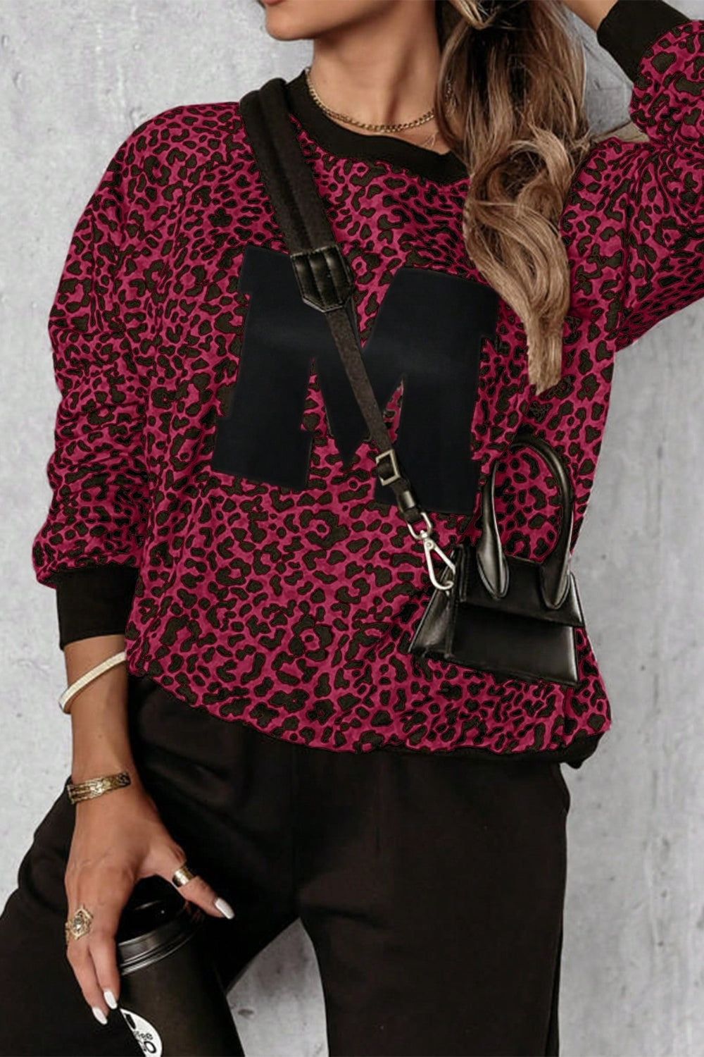 Burgundy leopard print loungewear set with black "M" appliqué on sweatshirt.