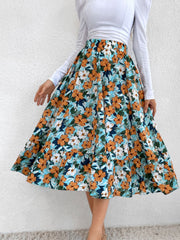 Tiered midi skirt with floral print and ruffled hem.