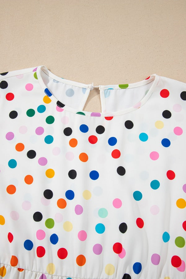 White polka dot blouse with flutter sleeves and keyhole back detail.