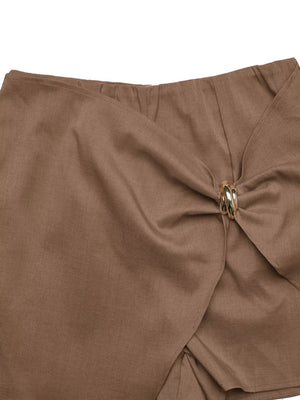 Brown twist-front skort with decorative gold button detail