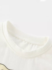 White cotton toddler t-shirt with elephant graphic detail and ribbed neckline.
