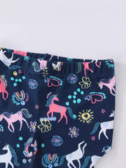 Navy cotton toddler leggings with a whimsical unicorn and flower print.