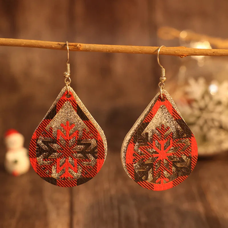 Plaid snowflake drop earrings in deep red with glitter accents.