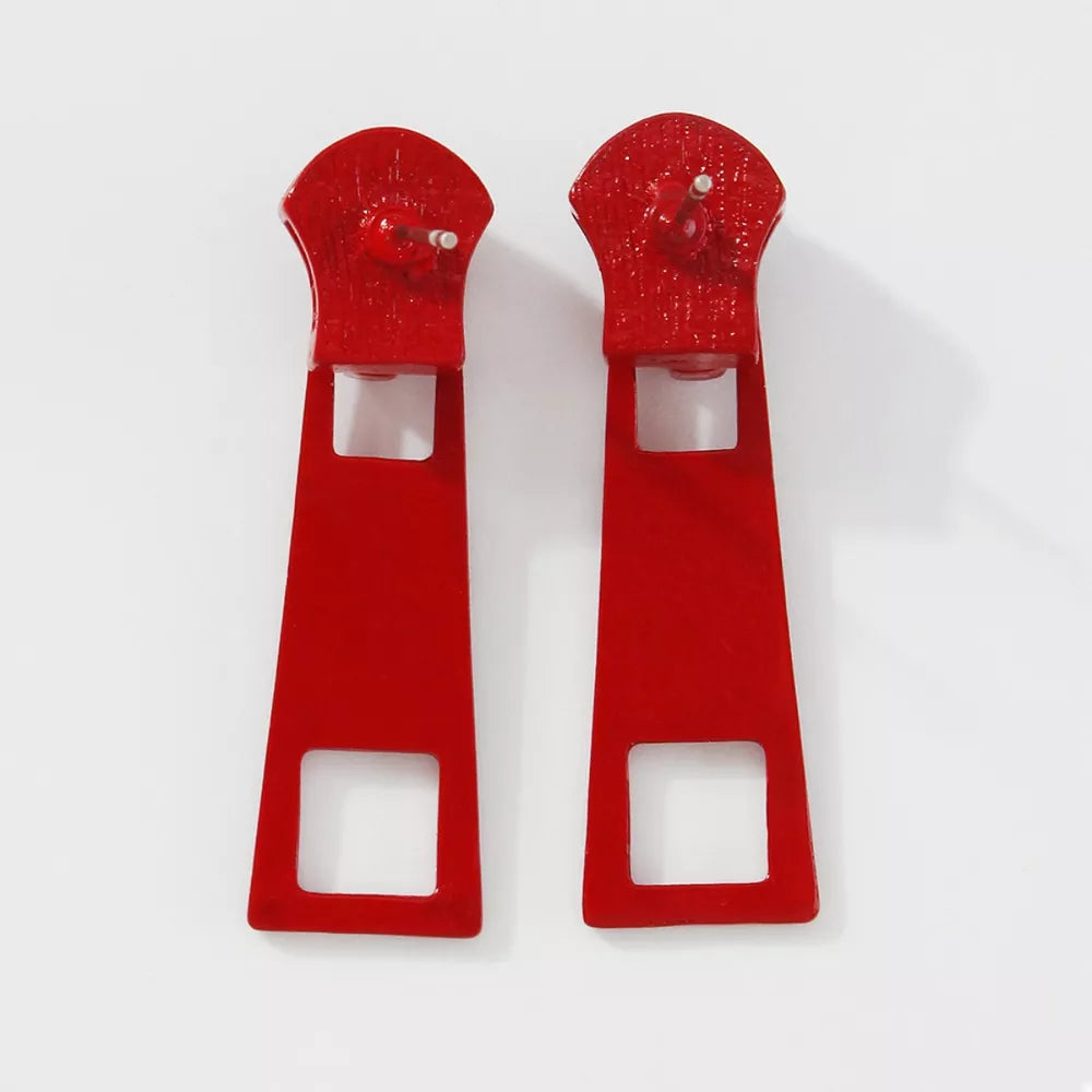 Red zipper drop earrings with square cutouts and alloy hardware.