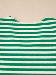 Green and white striped sweater with a V-neck and textured fabric.