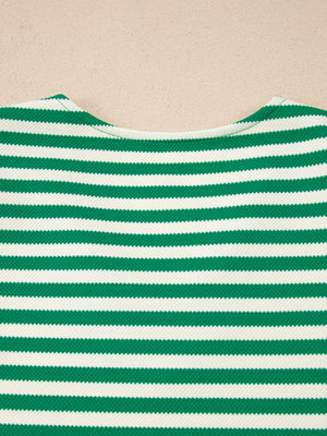 Green and white striped sweater with a V-neck and textured fabric.