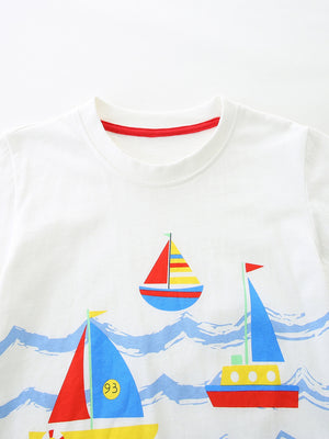 White cotton t-shirt with a nautical sailboat print and red trim neckline.