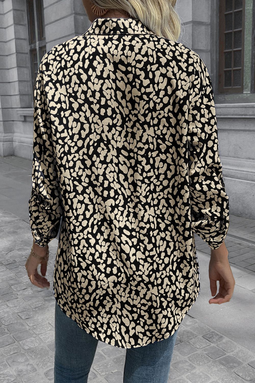 Black and beige abstract spot print oversized shirt with buttoned cuffs.