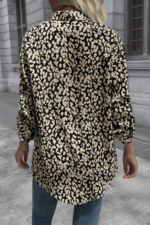 Black and beige abstract spot print oversized shirt with buttoned cuffs.
