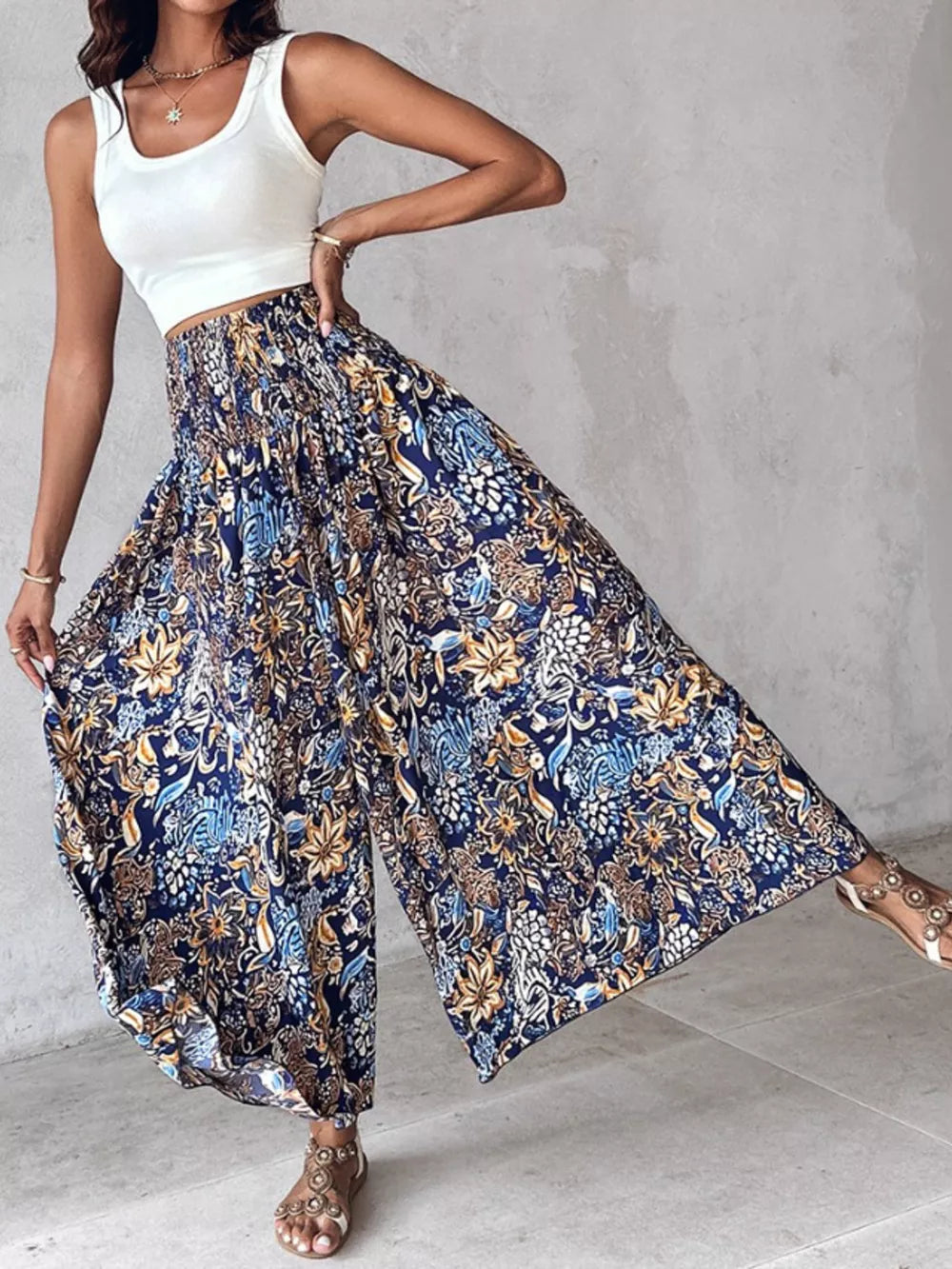 Bohemian print smocked waist wide-leg pants in dark navy with a floral pattern.