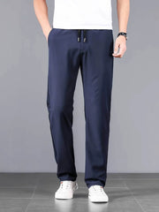 Navy blue casual drawstring sweatpants with pockets and a relaxed fit.