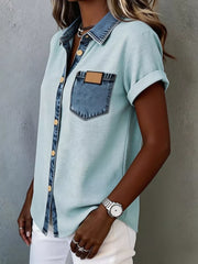 Heathered light blue short sleeve maternity shirt with denim accents and button front.