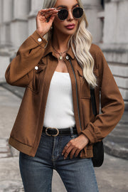 Textured chevron zip-front utility jacket in burnt umber with button flap pockets and ribbed cuffs.