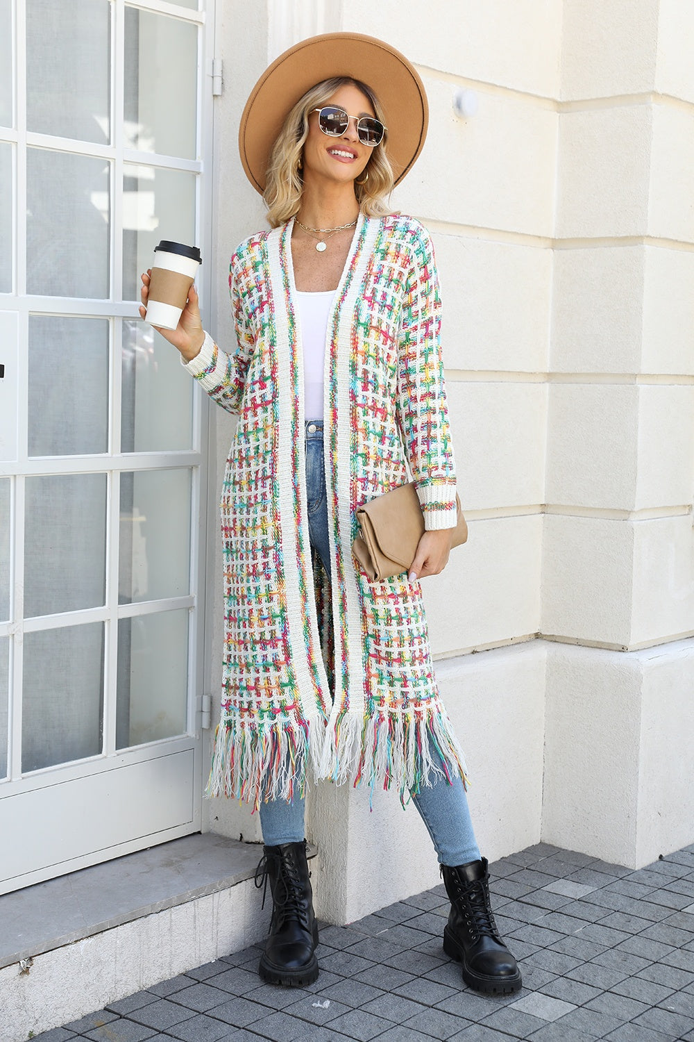 Chromatic crochet maxi cardigan with fringe detail and colorful woven pattern.