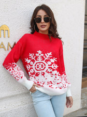 Red acrylic mock neck sweater with white snowflake intarsia pattern and white cuffs.