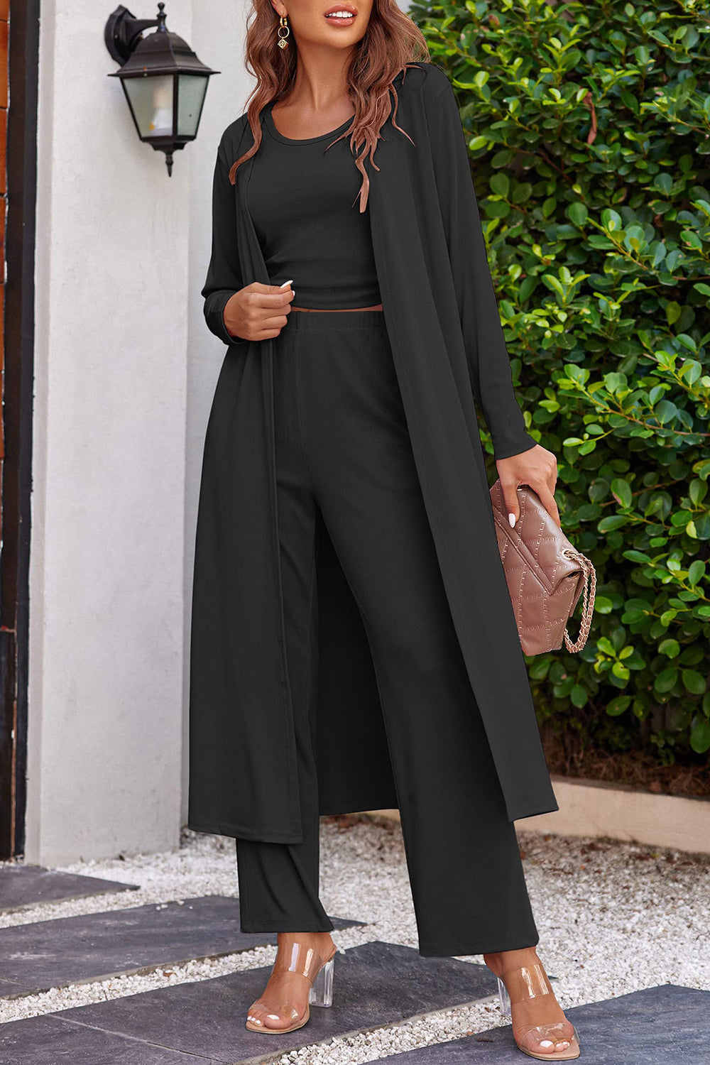 Black ribbed knit duster and lounge set with wide leg pants and crew neck top.