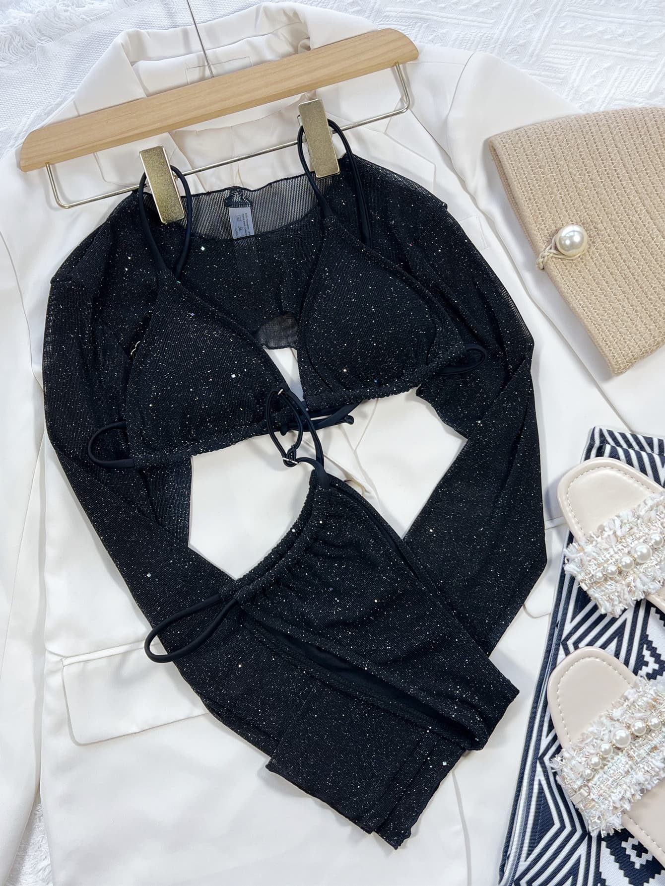 Black glitter mesh bikini set with long sleeve bolero and tie bottoms.