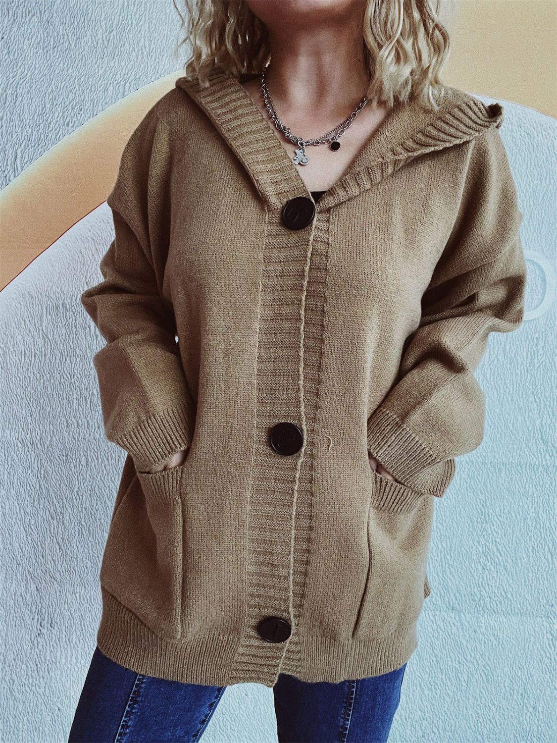 Taupe chunky knit hooded button-down cardigan with large dark buttons and pockets.