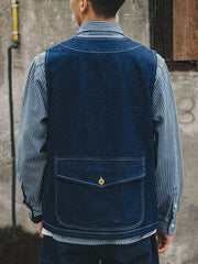 Plus-size navy denim vest with V-neck and single button-flap pocket.