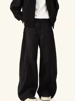 Black relaxed fit sweatpants with contrast side panels and a wide leg