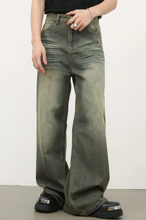 Vintage wash palazzo denim trousers in dark, featuring a wide leg and distressed details.