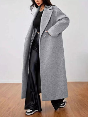 Gray wool-blend longline overcoat with button detail and wide lapels.