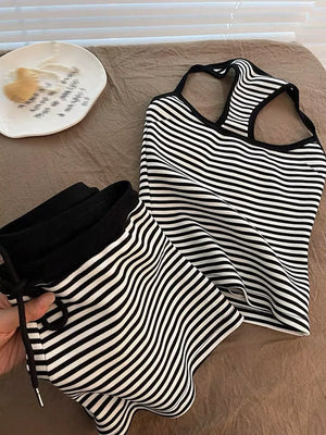 Black and white striped tank top and shorts set with drawstring waist.
