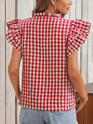 Gingham ruffle sleeve blouse in red and white with a mock neck.