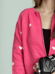 Hot Pink zip-through knit cardigan with white heart appliqué, acrylic fabric.