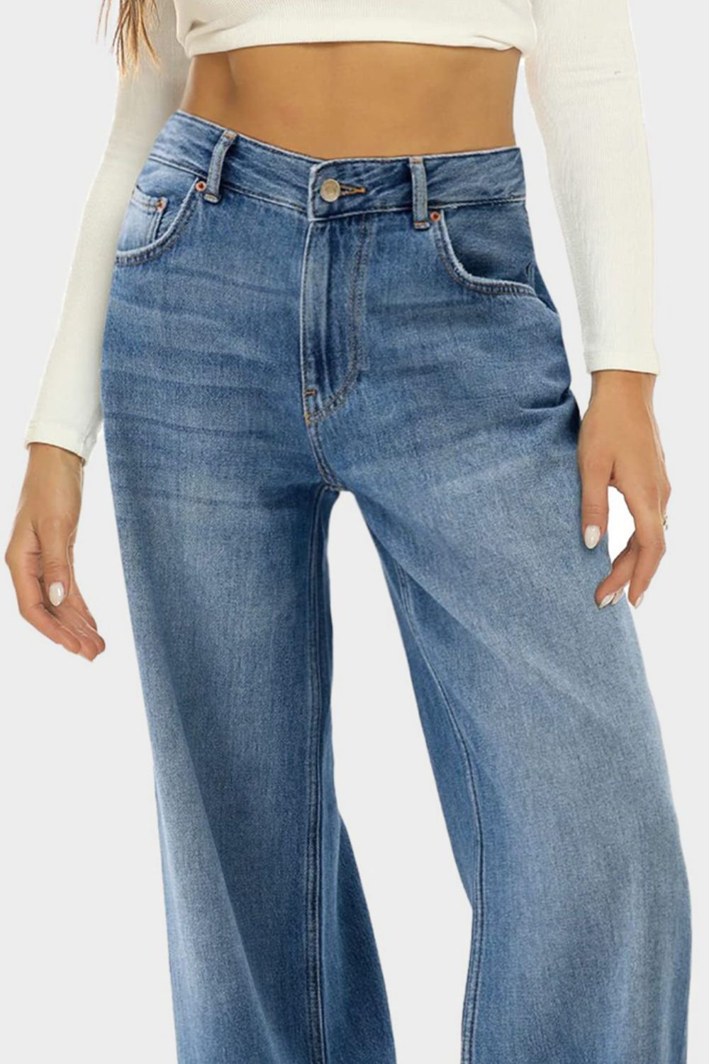 Wide-leg denim jeans in Dusty Blue with a subtle fade and button closure.
